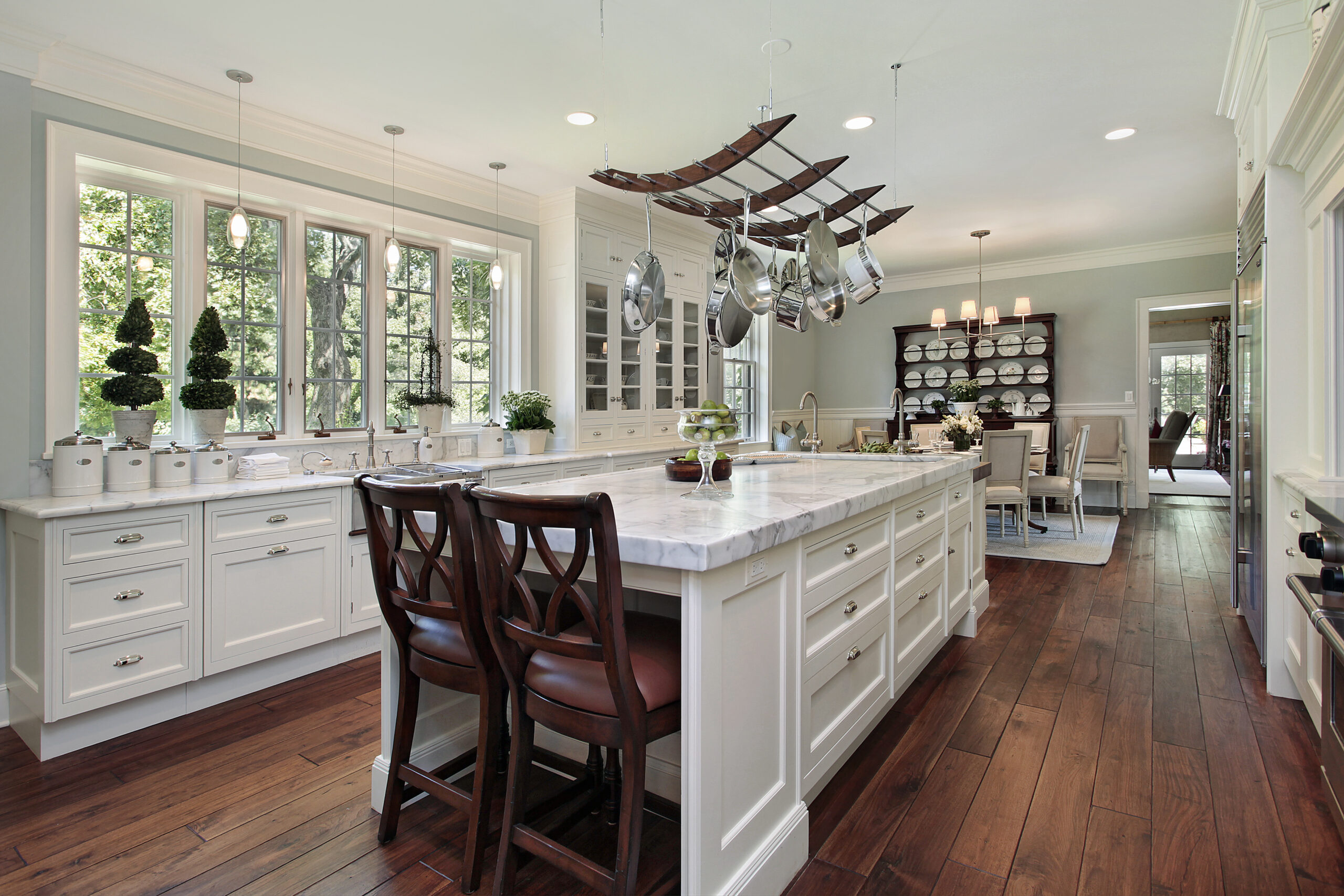 White quartz island with a white shaker cabinetry