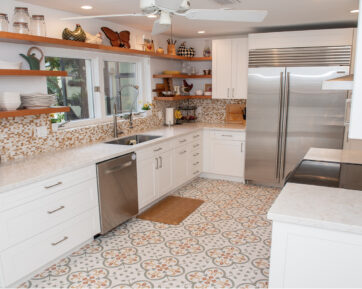 Paisley tiled kitchen with white cabinetry and open shelving